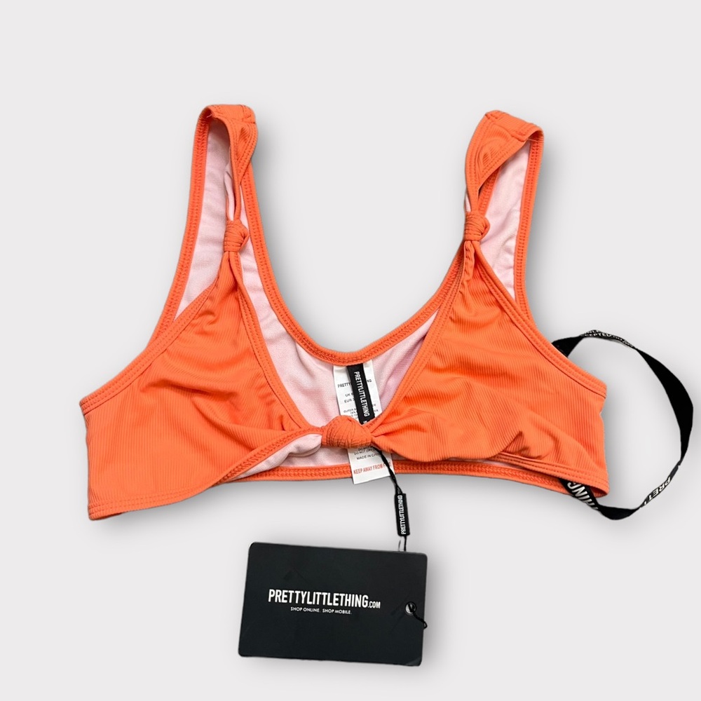 NWT. Coral/ Orange Pretty Little Thing Twist bikini top